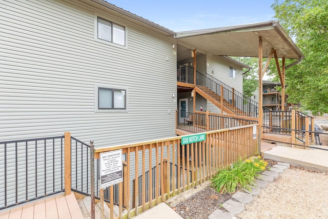 550 Notch Ln Unit 2, Reeds Spring, MO 65737 - rear view of property with stairs and a deck