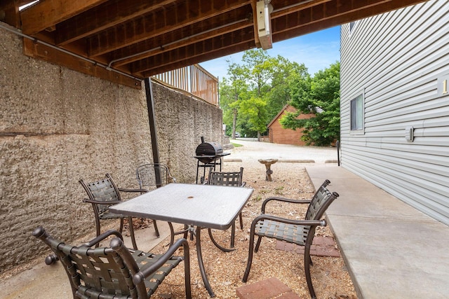 550 Notch Ln Unit 2, Reeds Spring, MO 65737 - view of patio / terrace with outdoor dining space and area for grilling