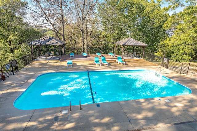 550 Notch Ln Unit 2, Reeds Spring, MO 65737 - view of pool with a gazebo, view of scattered trees, and a patio area