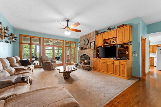 25158 Autumn View Dr, Shell Knob, MO 65747 - living room with ceiling fan, a brick fireplace, and wood finished floors