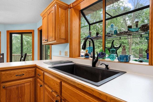 25158 Autumn View Dr, Shell Knob, MO 65747 - kitchen featuring a sink, light countertops, and brown cabinets