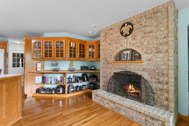25158 Autumn View Dr, Shell Knob, MO 65747 - living area with a brick fireplace and wood finished floors
