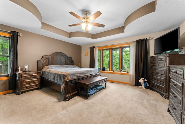 25158 Autumn View Dr, Shell Knob, MO 65747 - bedroom with baseboards, light carpet, a tray ceiling, and ceiling fan