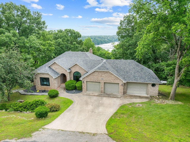 25158 Autumn View Dr, Shell Knob, MO 65747 - view of front facade featuring brick siding, a front yard, concrete driveway, and an attached garage