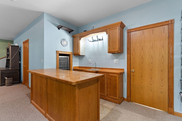 25158 Autumn View Dr, Shell Knob, MO 65747 - kitchen with a sink, brown cabinetry, light carpet, and butcher block counters