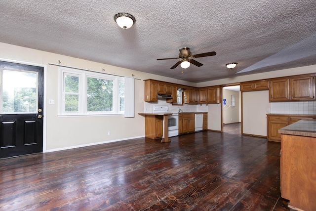 801 N 11th Ave, Ozark, MO 65721 - kitchen featuring white appliances, under cabinet range hood, dark wood-type flooring, a ceiling fan, and a textured ceiling