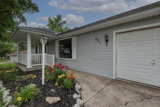 801 N 11th Ave, Ozark, MO 65721 - property entrance featuring covered porch and a garage