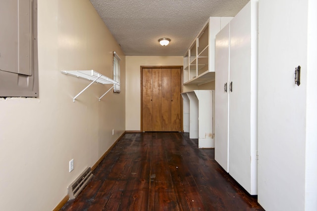 801 N 11th Ave, Ozark, MO 65721 - corridor featuring hardwood / wood-style floors, a textured ceiling, electric panel, and baseboards