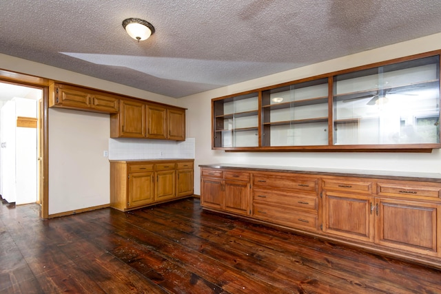 801 N 11th Ave, Ozark, MO 65721 - kitchen featuring dark wood-style flooring, open shelves, brown cabinets, light countertops, and a textured ceiling