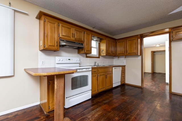 801 N 11th Ave, Ozark, MO 65721 - kitchen featuring white appliances, under cabinet range hood, baseboards, dark wood-style flooring, and brown cabinets