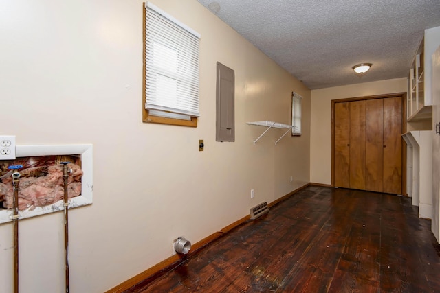 801 N 11th Ave, Ozark, MO 65721 - laundry room with hardwood / wood-style floors, electric panel, a textured ceiling, and baseboards