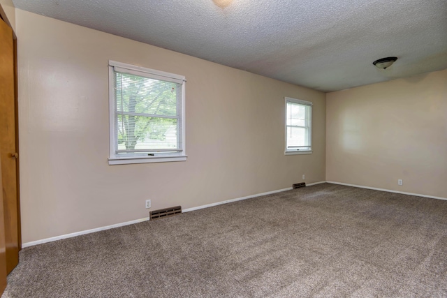801 N 11th Ave, Ozark, MO 65721 - carpeted spare room featuring a textured ceiling and baseboards