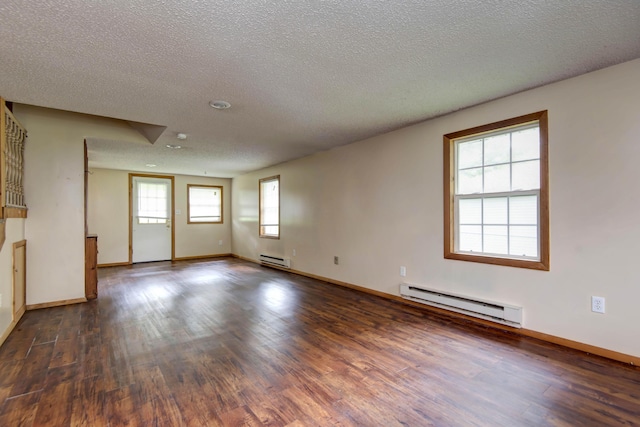 801 N 11th Ave, Ozark, MO 65721 - empty room with baseboard heating, wood finished floors, baseboards, and a textured ceiling