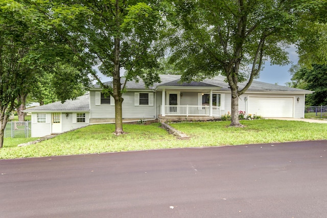 801 N 11th Ave, Ozark, MO 65721 - single story home with covered porch, an attached garage, and driveway