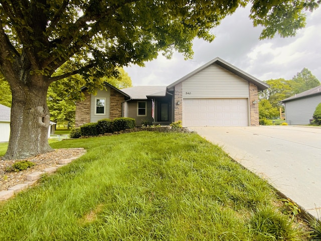 540 S Hickory Dr, Springfield, MO 65809 - ranch-style house featuring an attached garage, driveway, a front yard, and brick siding