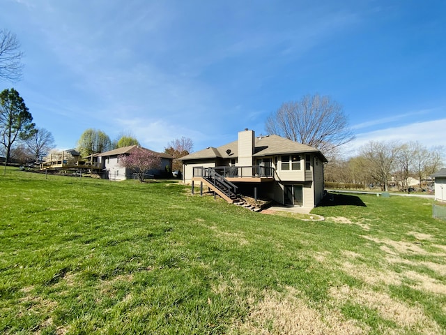 540 S Hickory Dr, Springfield, MO 65809 - back of property with a chimney, stairs, a deck, and a yard