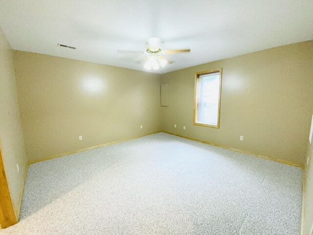 540 S Hickory Dr, Springfield, MO 65809 - carpeted spare room featuring a ceiling fan and baseboards