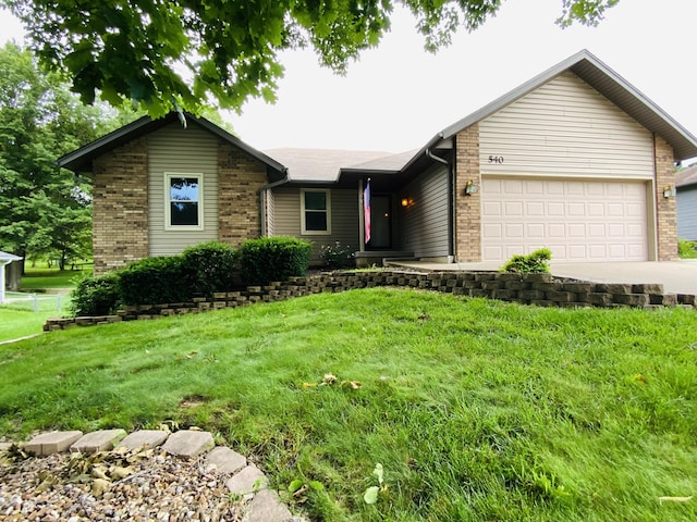 540 S Hickory Dr, Springfield, MO 65809 - single story home featuring driveway, a garage, brick siding, and a front yard
