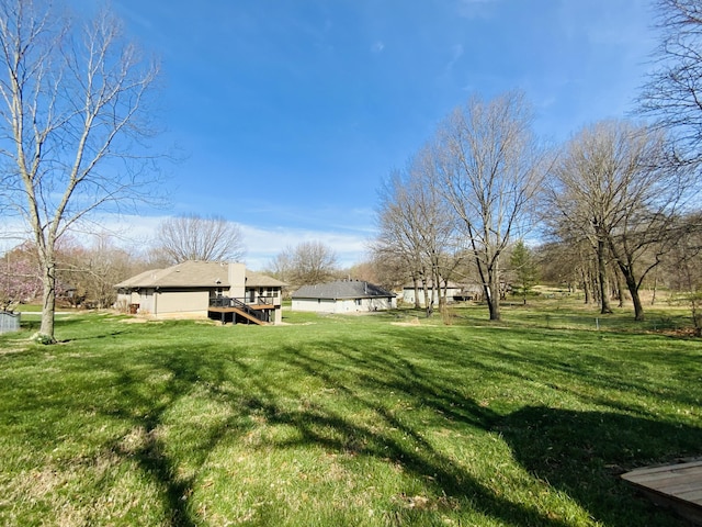 540 S Hickory Dr, Springfield, MO 65809 - view of green lawn featuring a deck and stairway