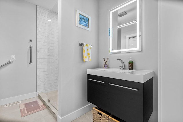 518 N Dublin Dr, Nixa, MO 65714 - full bathroom with vanity, a tile shower, baseboards, and tile patterned flooring