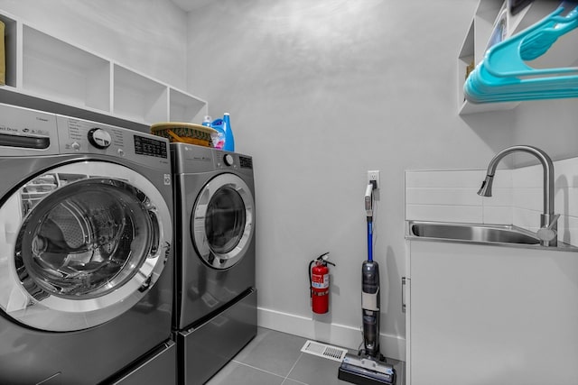 518 N Dublin Dr, Nixa, MO 65714 - laundry area featuring washing machine and dryer and tile patterned flooring