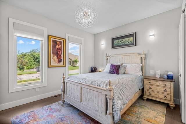 518 N Dublin Dr, Nixa, MO 65714 - bedroom with baseboards, a chandelier, and wood finished floors