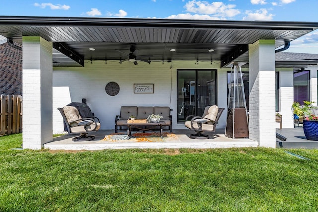 518 N Dublin Dr, Nixa, MO 65714 - rear view of house with a ceiling fan, an outdoor hangout area, a patio area, and brick siding