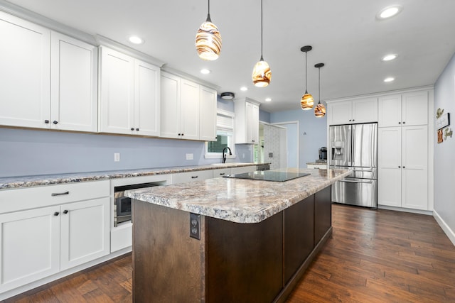 4159 N Farm Rd Unit 173, Springfield, MO 65803 - kitchen featuring stainless steel refrigerator with ice dispenser, recessed lighting, a center island, white cabinetry, and dark wood-style flooring