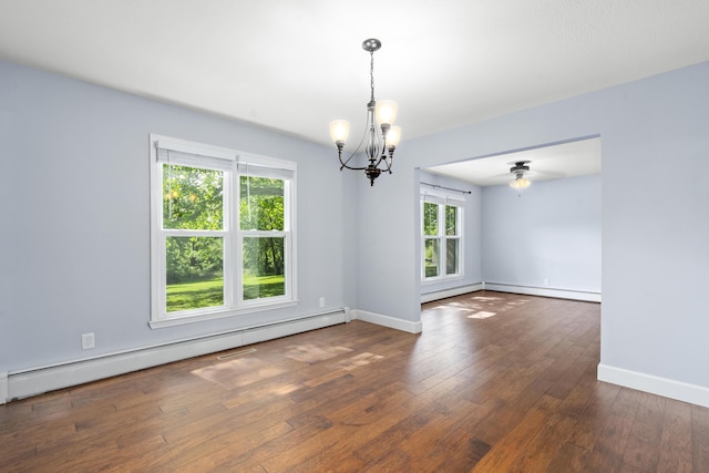 4159 N Farm Rd Unit 173, Springfield, MO 65803 - spare room featuring a baseboard radiator, a chandelier, hardwood / wood-style flooring, and baseboards
