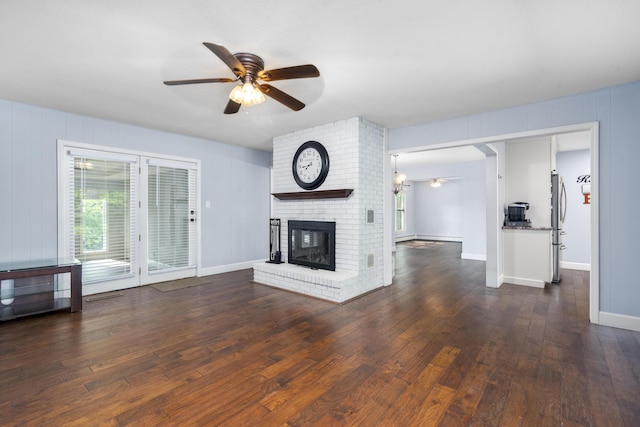 4159 N Farm Rd Unit 173, Springfield, MO 65803 - unfurnished living room featuring plenty of natural light, a ceiling fan, hardwood / wood-style floors, and a brick fireplace