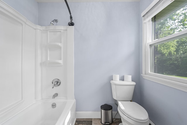 4159 N Farm Rd Unit 173, Springfield, MO 65803 - bathroom featuring baseboards,  shower combination, healthy amount of natural light, and toilet