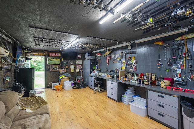 4159 N Farm Rd Unit 173, Springfield, MO 65803 - miscellaneous room with a workshop area and wood finished floors