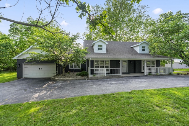 4159 N Farm Rd Unit 173, Springfield, MO 65803 - new england style home featuring asphalt driveway, covered porch, a garage, and a front yard