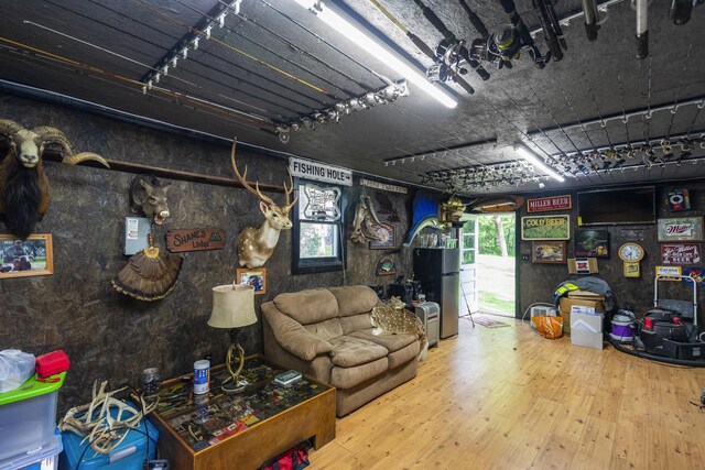 4159 N Farm Rd Unit 173, Springfield, MO 65803 - living room featuring plenty of natural light and wood finished floors