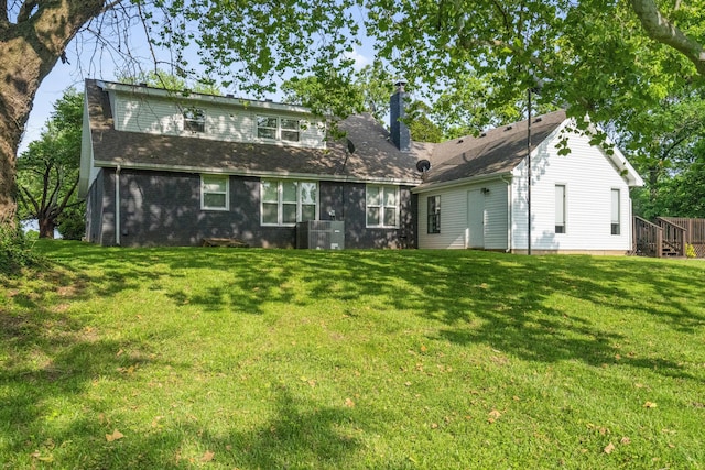 4159 N Farm Rd Unit 173, Springfield, MO 65803 - rear view of property featuring a chimney and a yard
