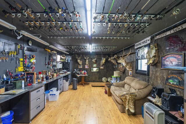 4159 N Farm Rd Unit 173, Springfield, MO 65803 - miscellaneous room with wood finished floors and a workshop area