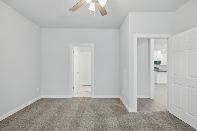 406 Barton Pl, Neosho, MO 64850 - carpeted empty room featuring a ceiling fan and baseboards