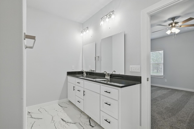 406 Barton Pl, Neosho, MO 64850 - bathroom featuring baseboards, double vanity, ceiling fan, and marble look tile flooring
