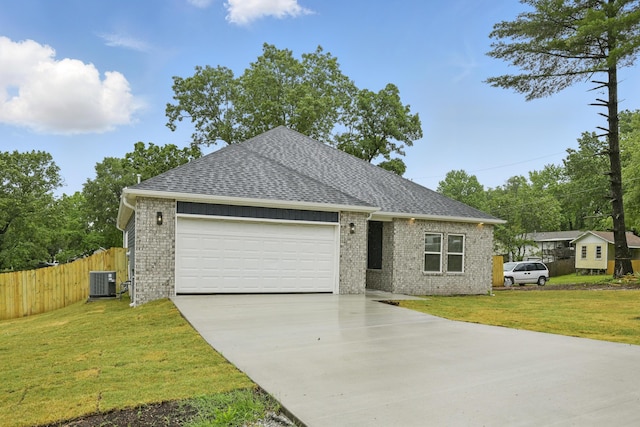 406 Barton Pl, Neosho, MO 64850 - ranch-style house featuring driveway, central AC, a shingled roof, and brick siding
