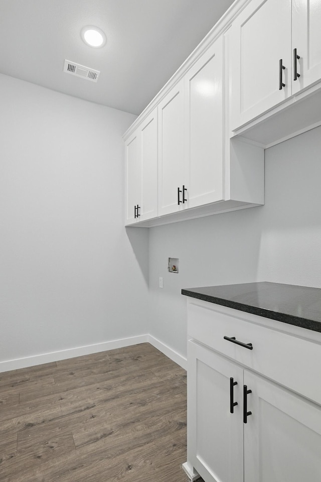 406 Barton Pl, Neosho, MO 64850 - laundry room with cabinet space, dark wood-type flooring, baseboards, washer hookup, and recessed lighting