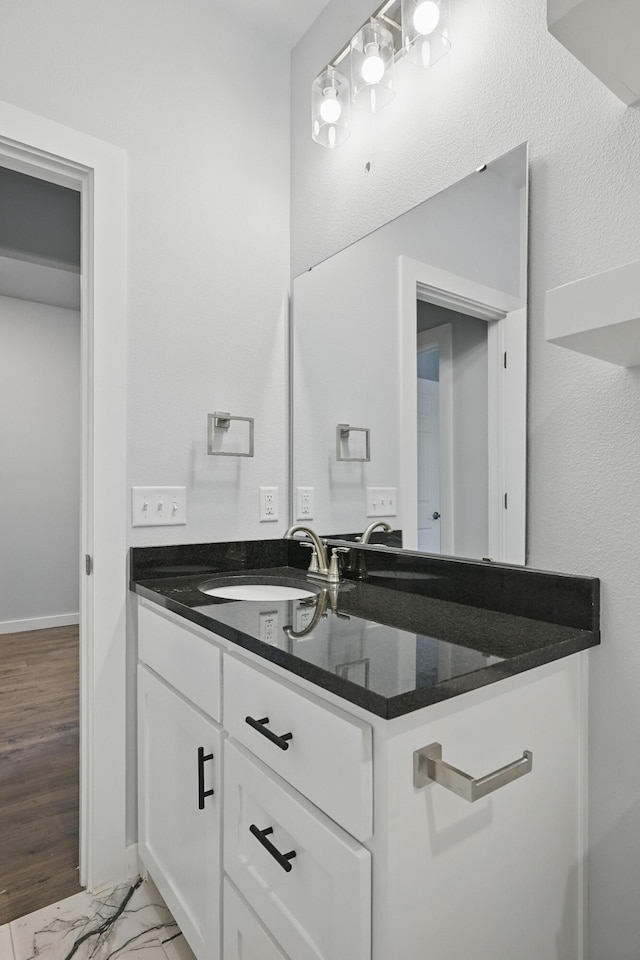 406 Barton Pl, Neosho, MO 64850 - bathroom with vanity, marble finish floors, and baseboards