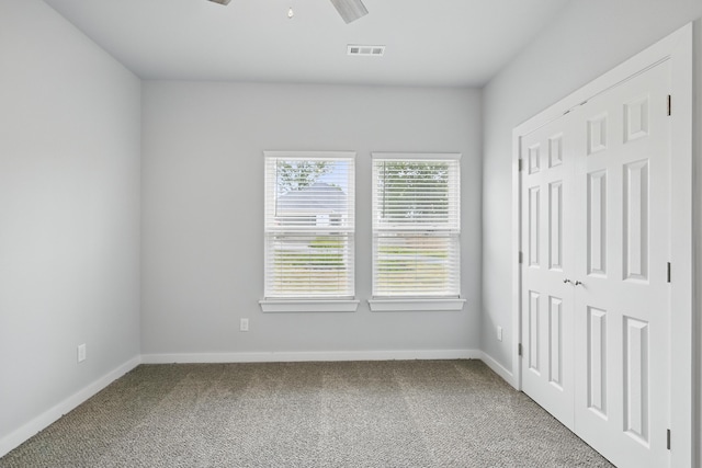 406 Barton Pl, Neosho, MO 64850 - unfurnished bedroom featuring carpet flooring, baseboards, a closet, and a ceiling fan