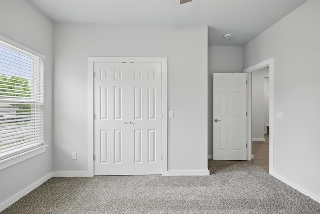 406 Barton Pl, Neosho, MO 64850 - unfurnished bedroom featuring carpet, a closet, and baseboards