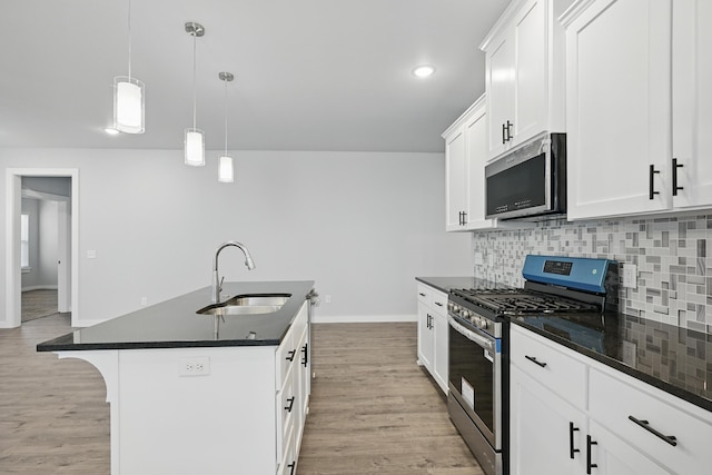 406 Barton Pl, Neosho, MO 64850 - kitchen featuring appliances with stainless steel finishes, a sink, dark countertops, backsplash, and baseboards