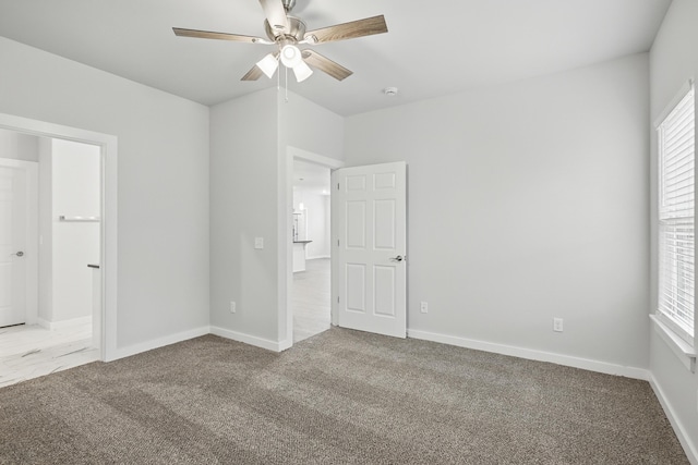 406 Barton Pl, Neosho, MO 64850 - unfurnished bedroom with carpet floors, multiple windows, and baseboards