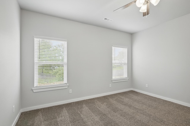 406 Barton Pl, Neosho, MO 64850 - carpeted empty room featuring a ceiling fan, plenty of natural light, and baseboards