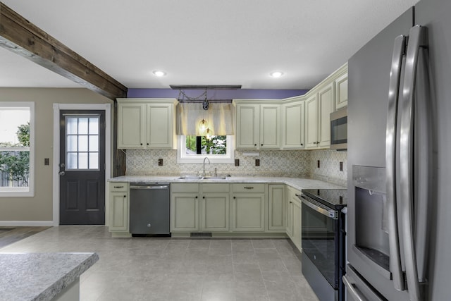 2236 E Logan St, Republic, MO 65738 - kitchen with stainless steel appliances, a sink, decorative backsplash, baseboards, and recessed lighting