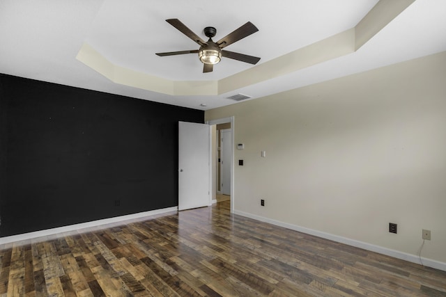 2236 E Logan St, Republic, MO 65738 - spare room featuring wood finished floors, a ceiling fan, a tray ceiling, and baseboards