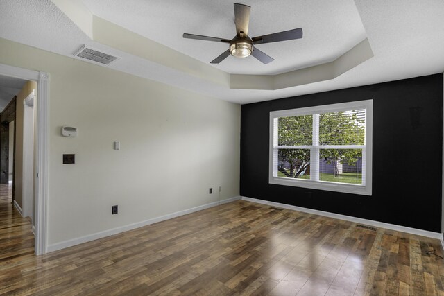 2236 E Logan St, Republic, MO 65738 - empty room with wood finished floors, ceiling fan, baseboards, and a textured ceiling