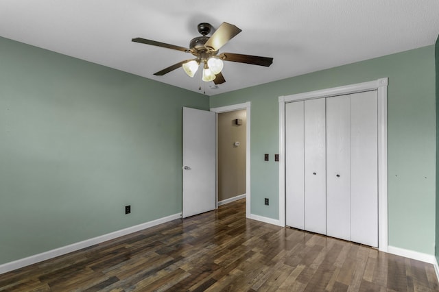 2236 E Logan St, Republic, MO 65738 - unfurnished bedroom with baseboards, dark wood-type flooring, a closet, and ceiling fan